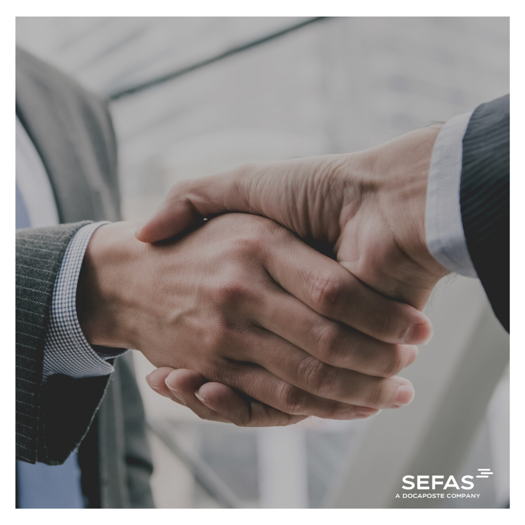 Focus on Partnership showing 2 men shaking hands