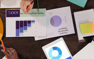 Graphic depicting customer services with several papers on a desk with a laptop.