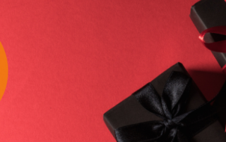 Black Friday image of presents wrapped in black paper with red ribbons