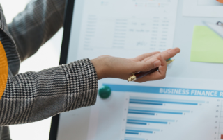 Marketplace analysts looking at a white board