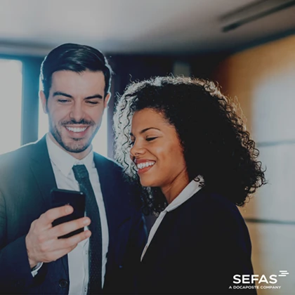 2 people looking at a mobile phone