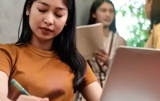 visually impaired woman working at office, blurry light around